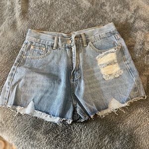 Distressed denim shorts